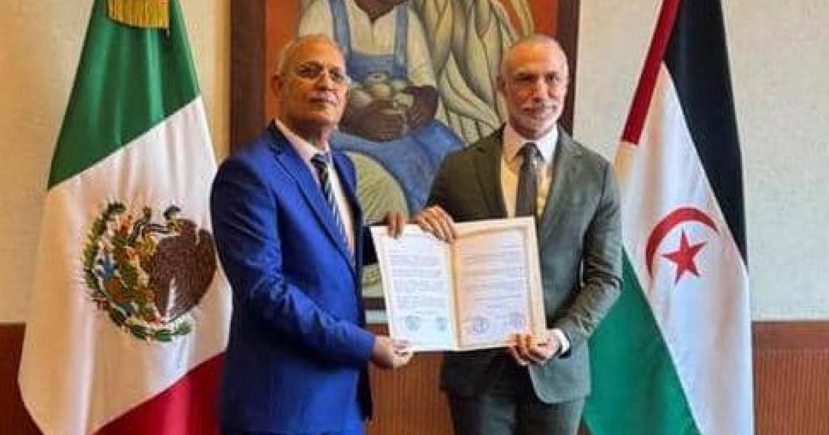 Ambassador Omar Bulsan presents copies of his credentials as Ambassador Extraordinary and Plenipotentiary to Mexico